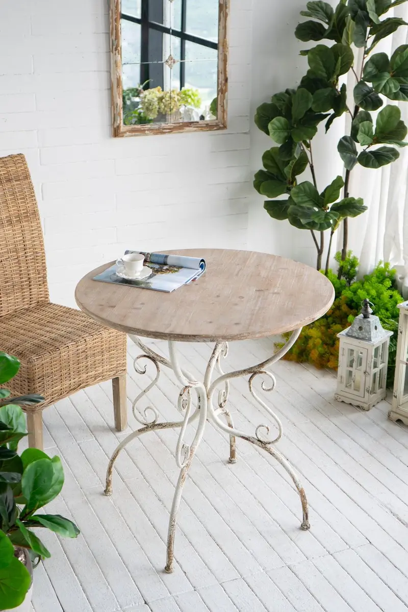 Round Whitewashed Wooden Table With Decorative Metal Legs 1